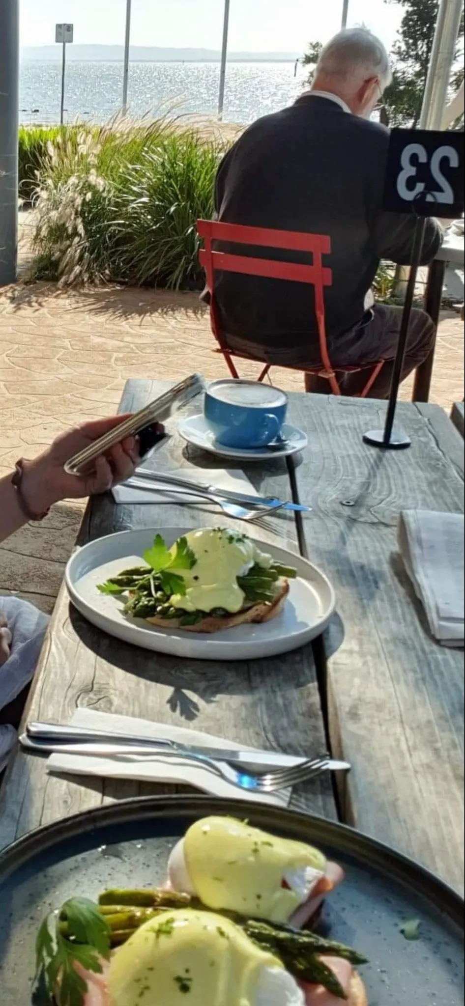 Outdoor terrace at My Seaside Cafe with bay views